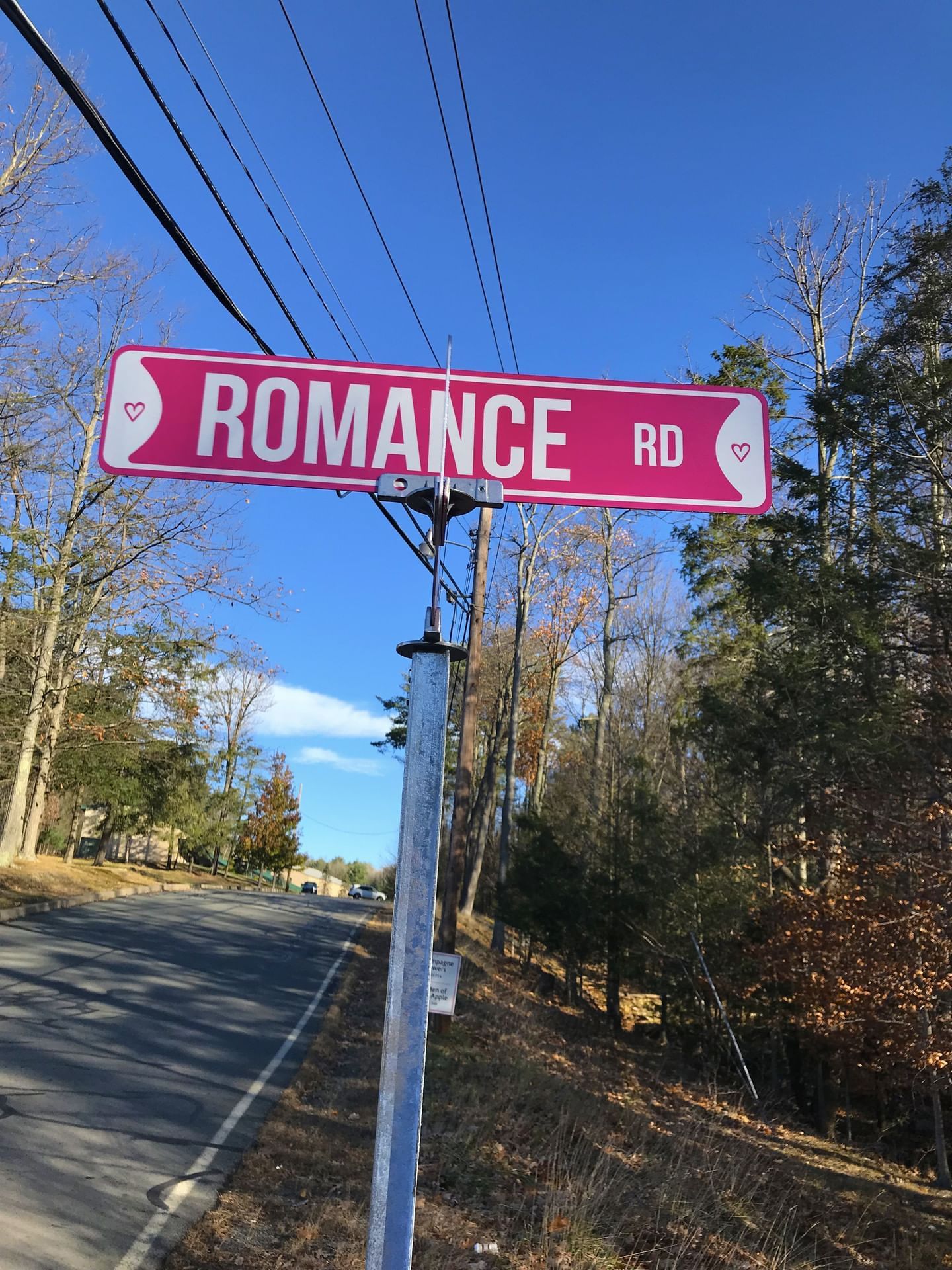 Romance road name board near Cove Haven Resort