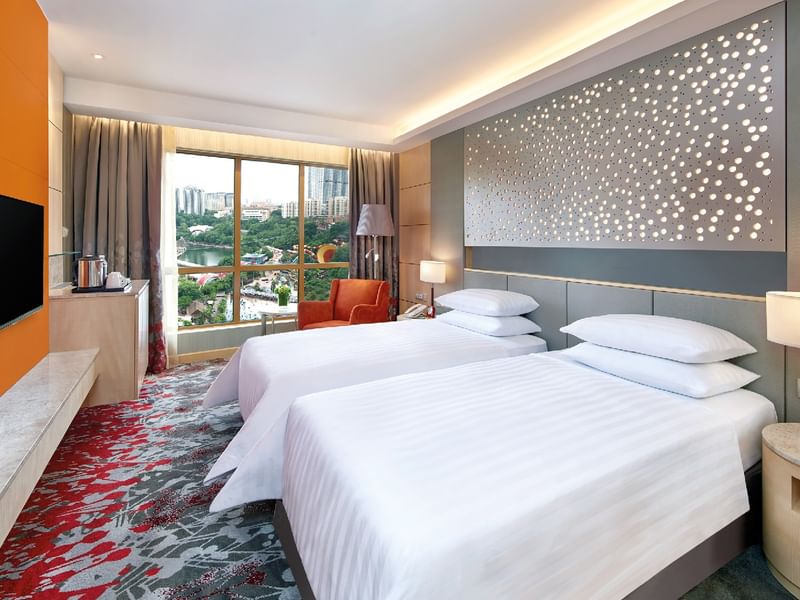 Bright Deluxe Park Twin Room at Sunway Hotel Pyramid, featuring two beds, a balcony, and city views.