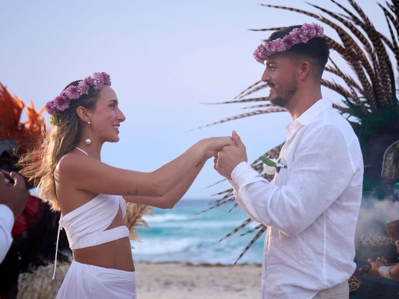 Couple enjoying time together on a beach at Fiesta Americana