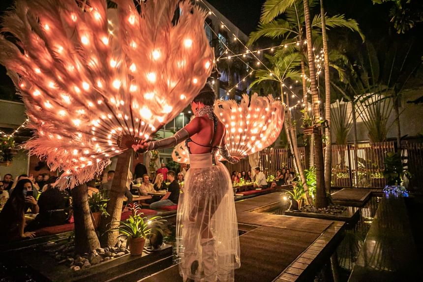 Female dancer at an outdoor event in South Beach Hotel at night