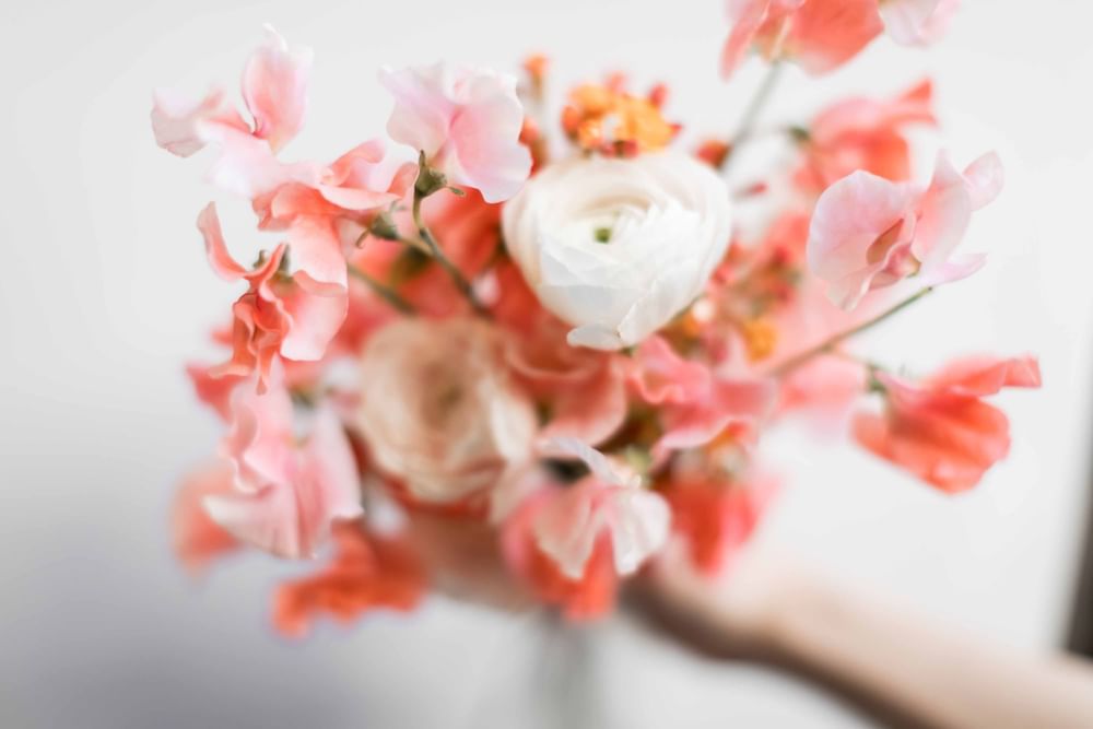 Close-up of a bouquet of peach and pink flowers at El Prado Hotel