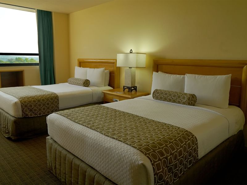 Twin comfy beds in Superior Room at Gamma Hotels