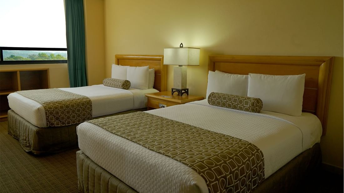 Twin comfy beds in Superior Room at Gamma Hotels
