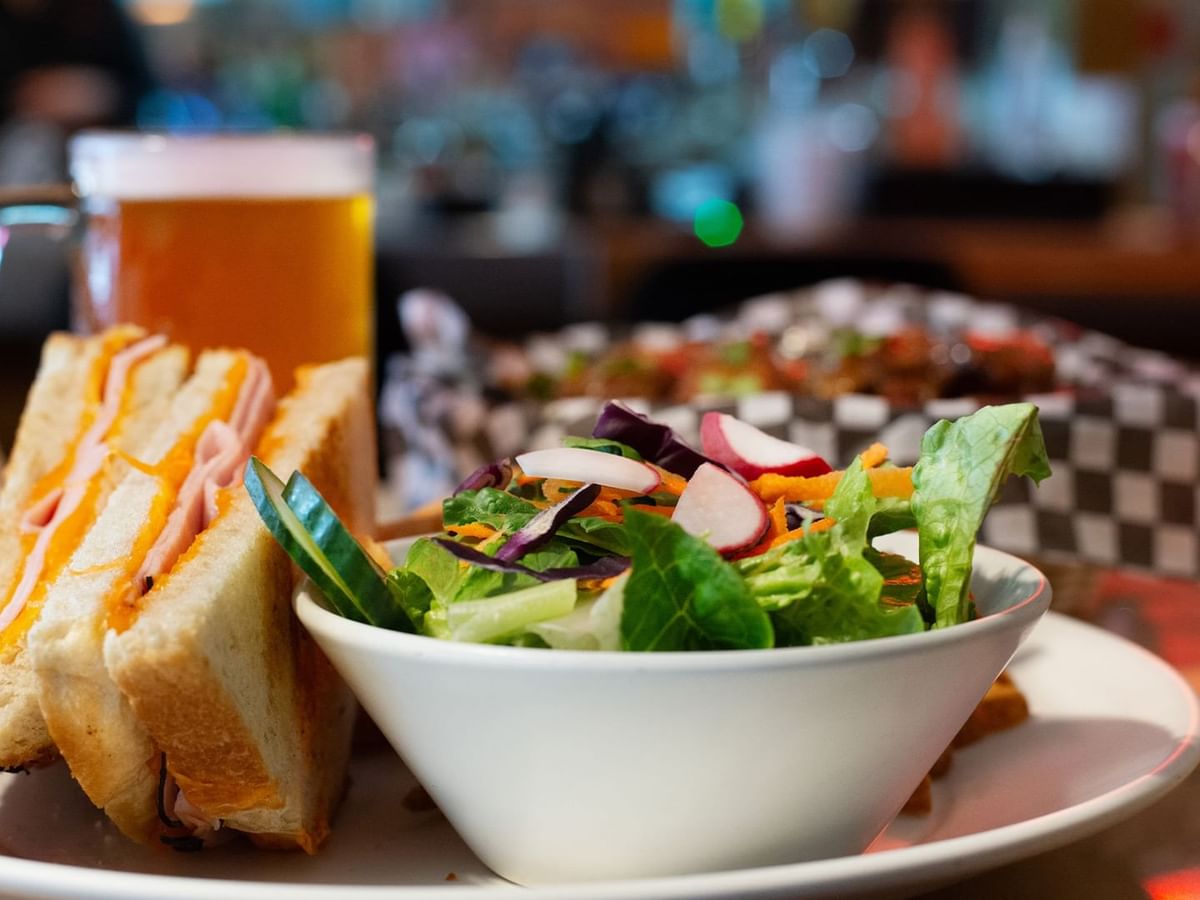Salad, sandwich and beer