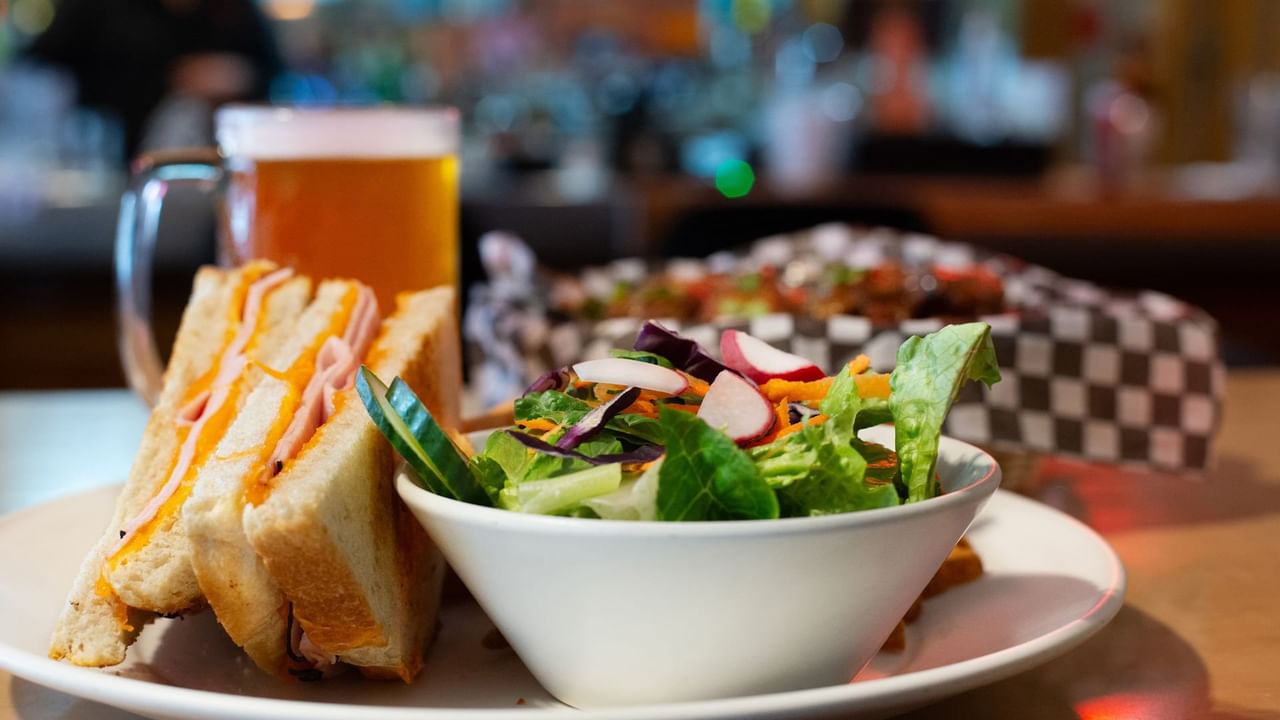 Salad, sandwich and beer