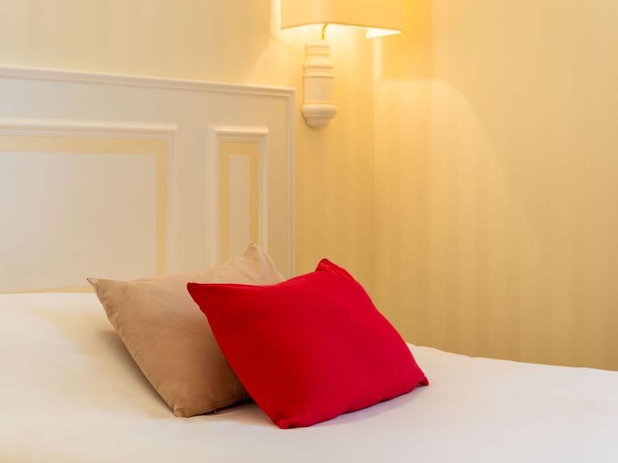 Closeup of a Bedroom with pillows at Hotel Chantecler