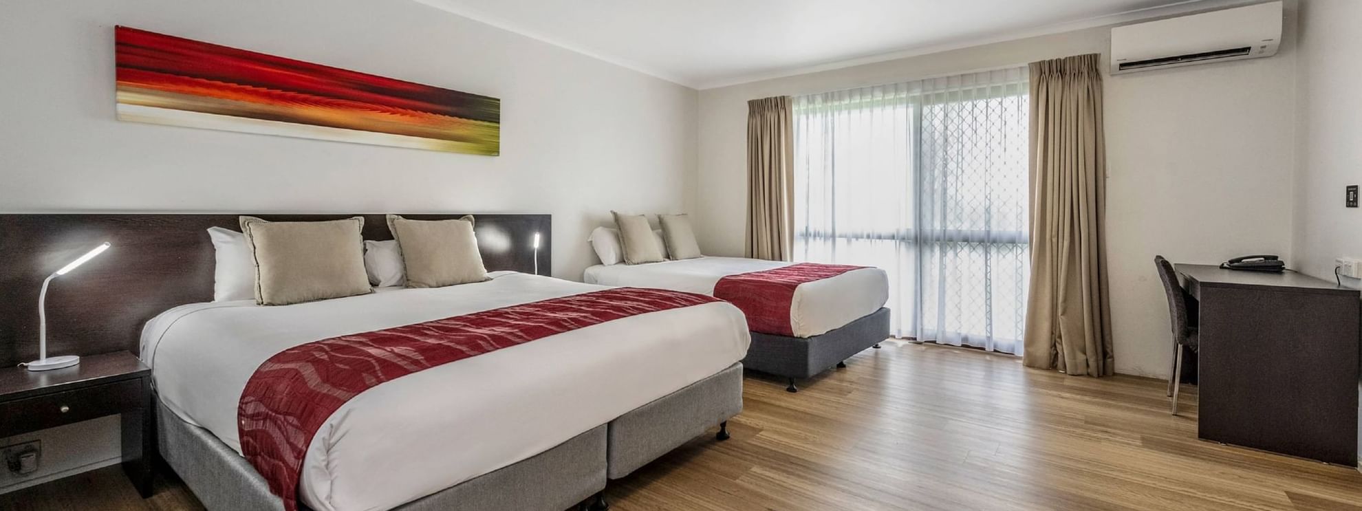 Upstairs Deluxe Twin Room features two Queen beds or a King bed and a Queen bed