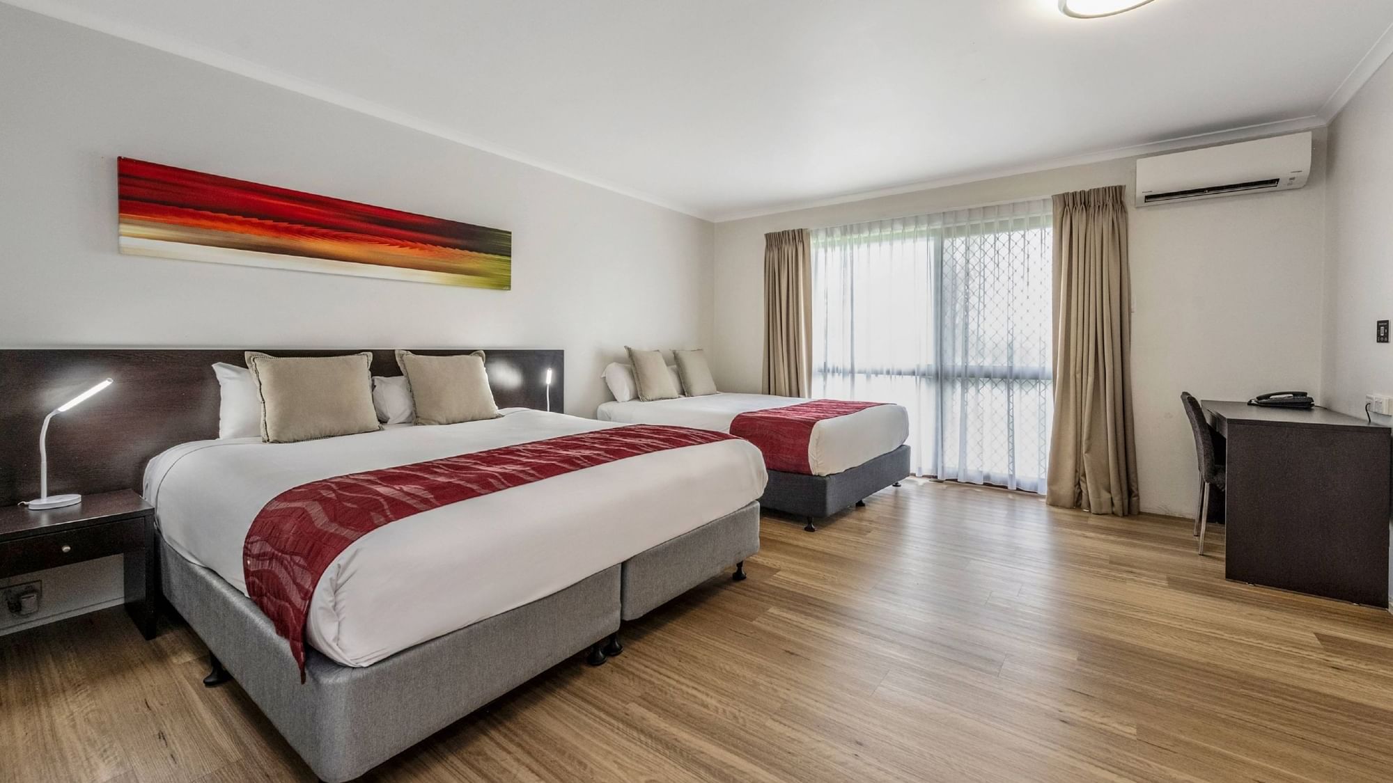 Upstairs Deluxe Twin Room features two Queen beds or a King bed and a Queen bed