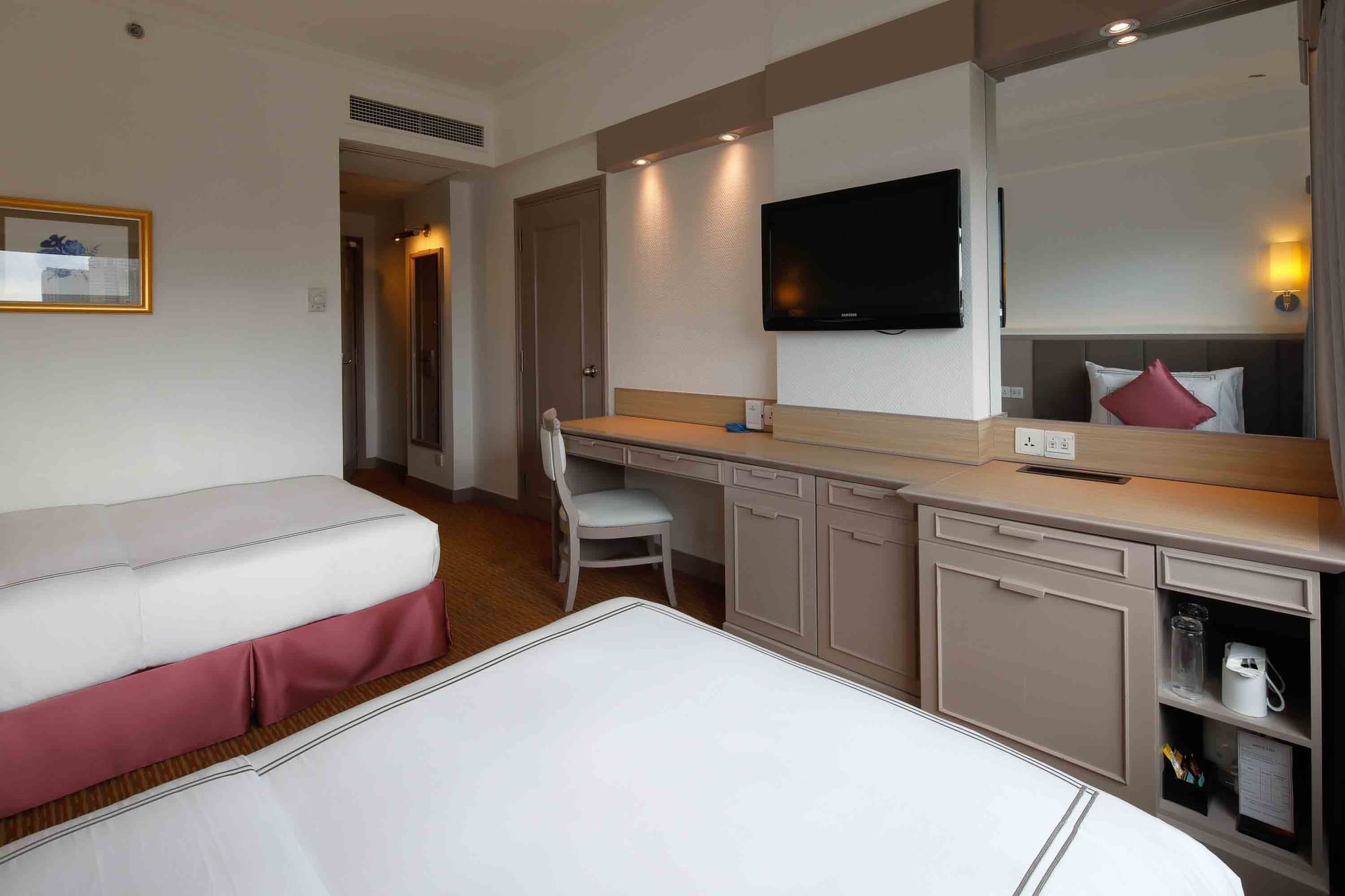 Work desk by the beds in Deluxe City View Twin at Sunway Hotel Hanoi
