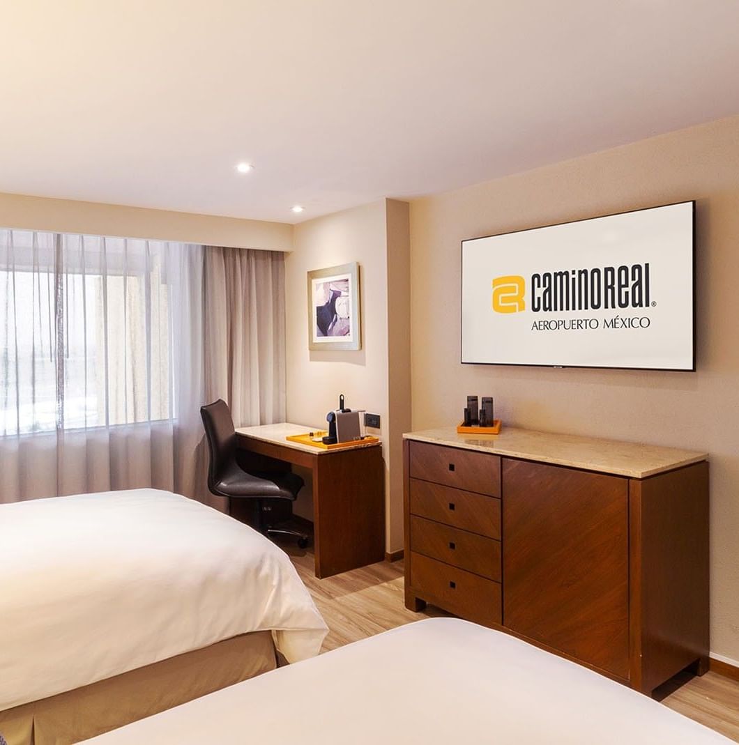 TV with work desk facing two beds by the window in 2 Double Camino Real Club Camino Real Aeropuerto Mexico