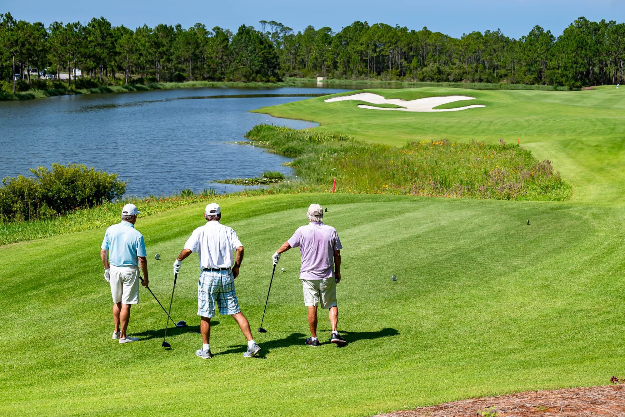 A group of men preparing to tee off at Camp Creek Golf Course