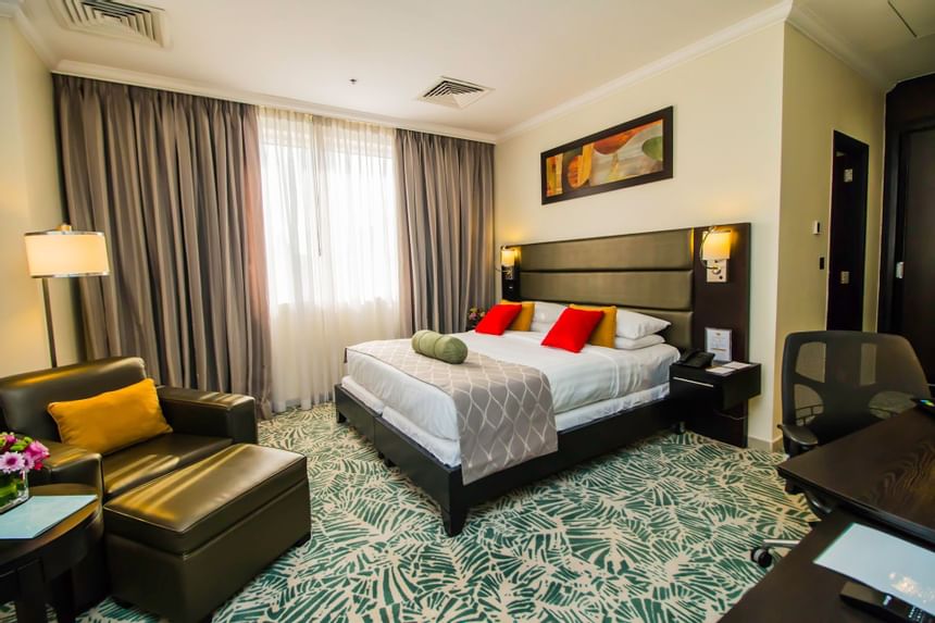 Bed & furniture in Executive Suite at The Royal Riviera Hotel