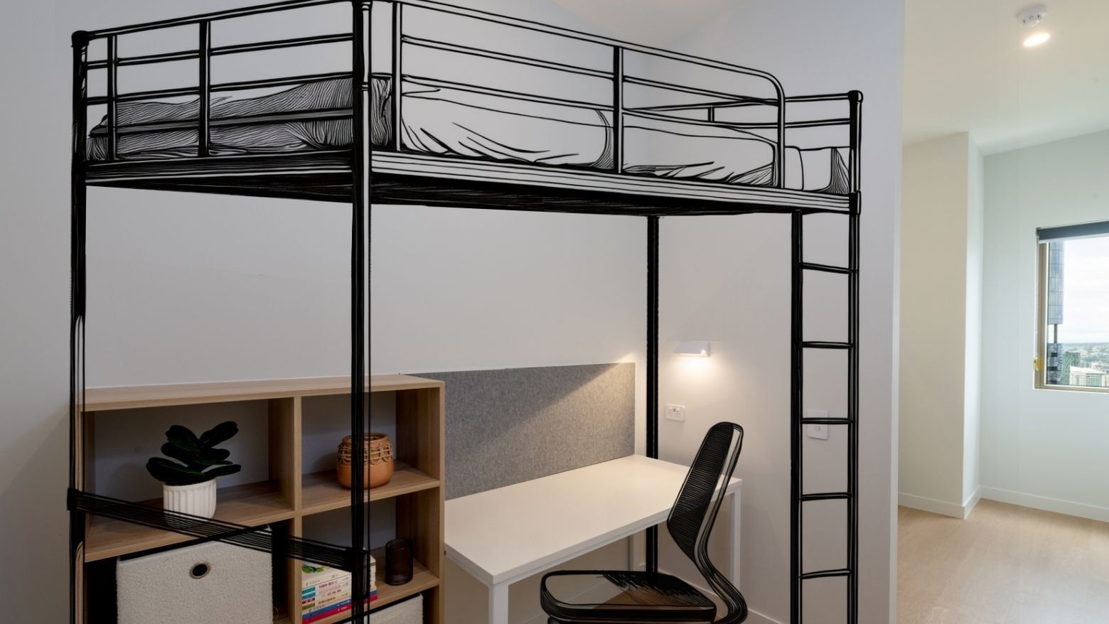 Bunk bed with desk and chair in a room at UniLodge Brisbane City.