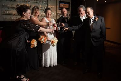 family toasting Champaign at The Inn of Waterloo