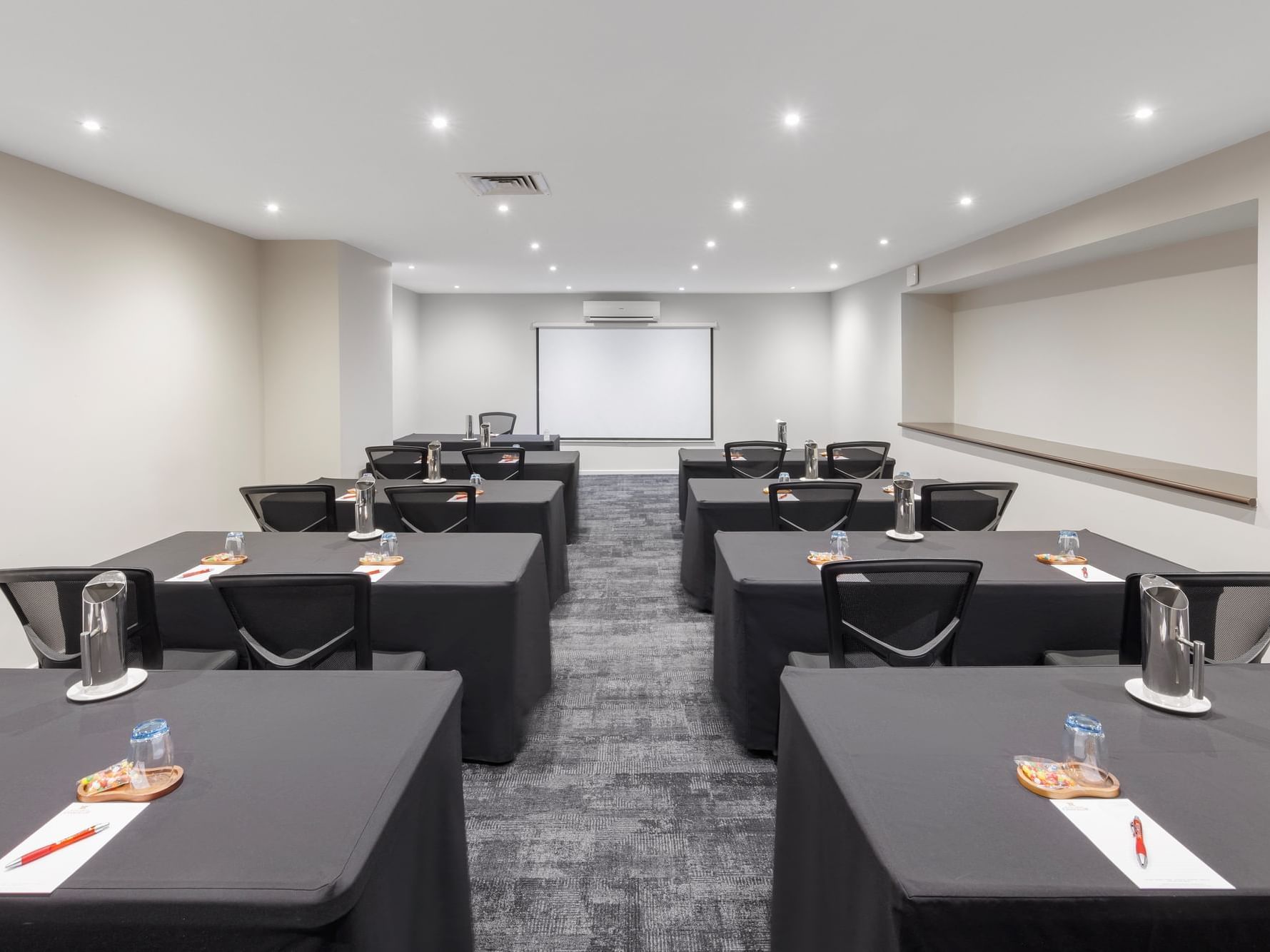 Classroom typed table set-up in Chancellor Four at Hotel Grand Chancellor Melbourne