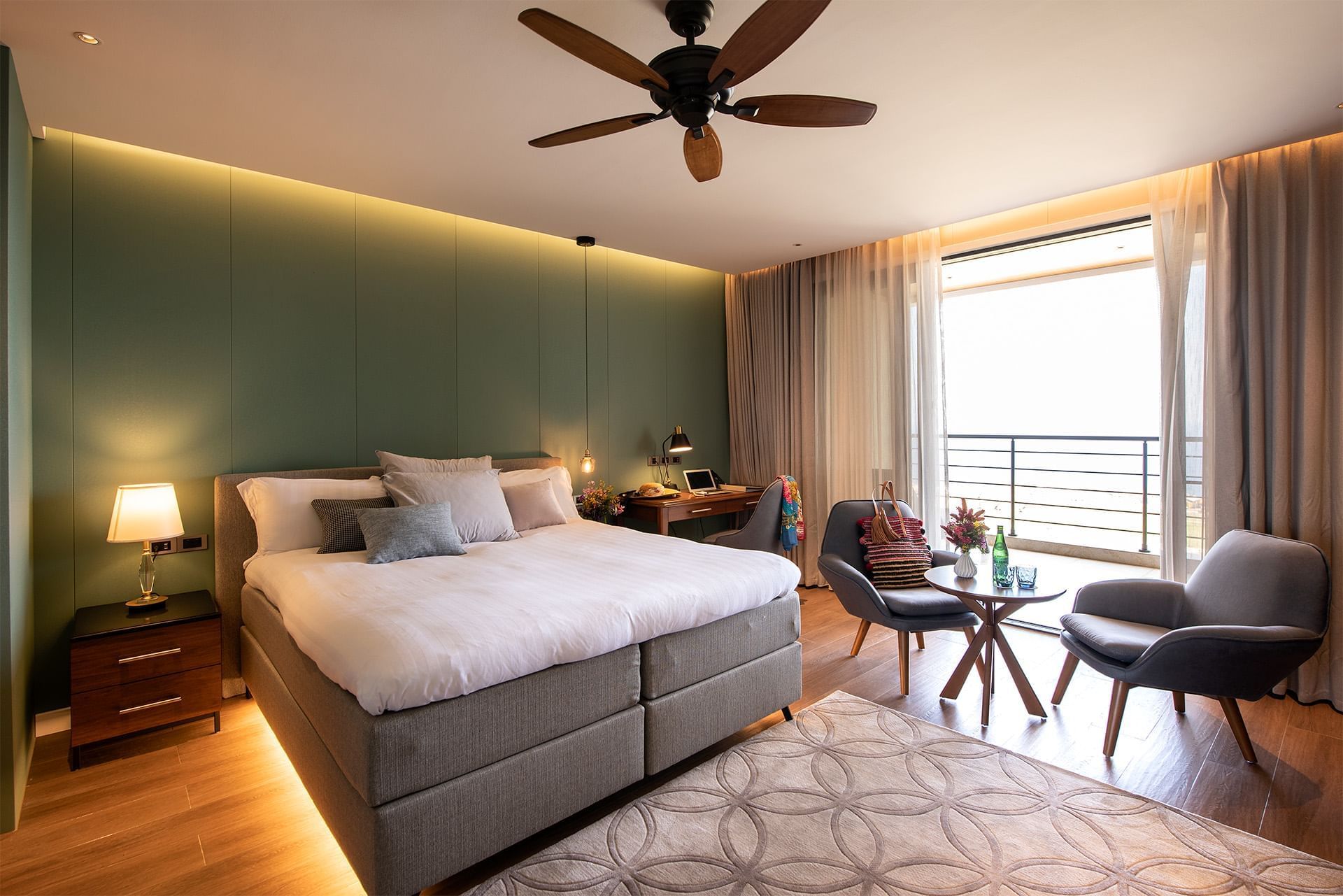 Bed & lounge area in Golden Rock Suites at Golden Rock Resort