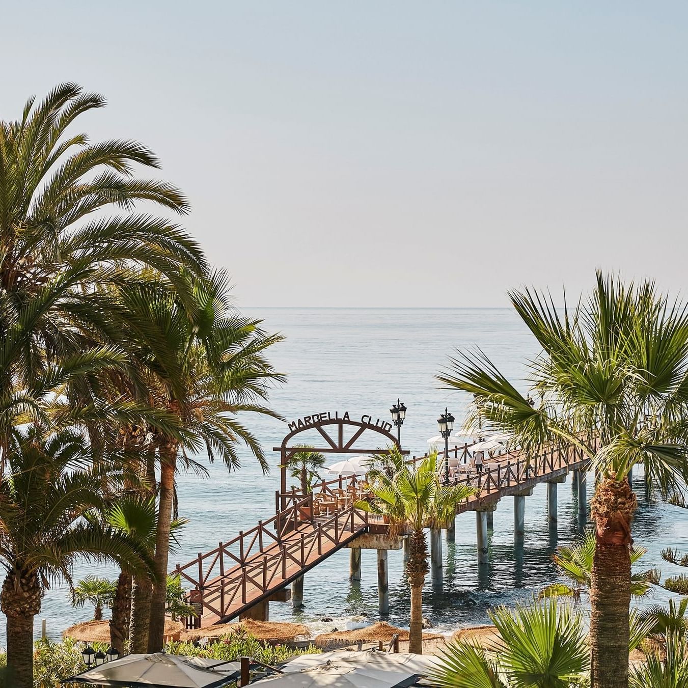 Long shot of a pier in the ocean at Marbella Club Hotel