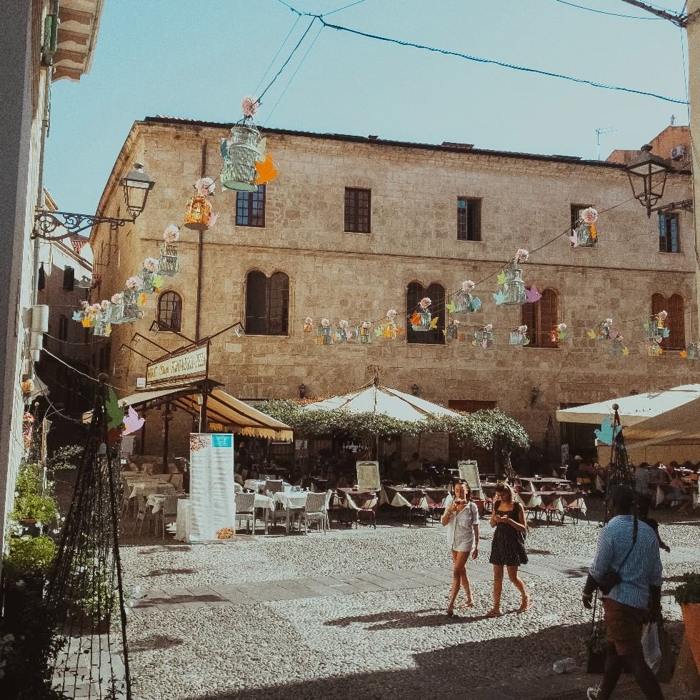 People Roaming in Alghero City near Falkensteiner Hotels