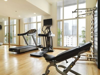 Exercise machines in a gym at Hotel Capitol Kuala Lumpur