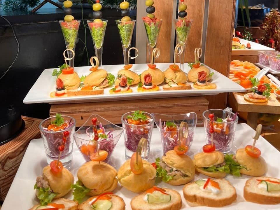 A variety of appetizers displayed on trays at a buffet Hi tea in Maya Brasserie at Hotel Maya Kuala Lumpur City Centre