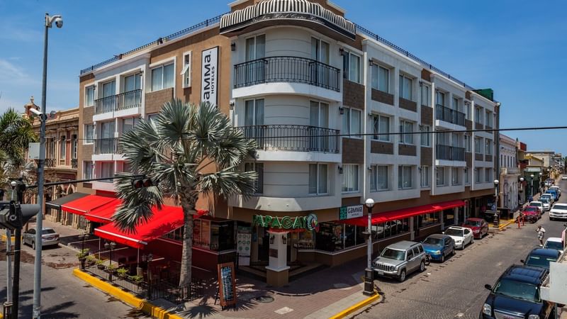 An exterior view of the hotel & street at Gamma Hotels