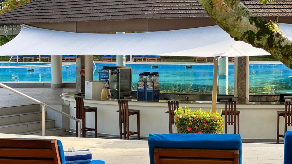 Lounge chairs by the pool at The Naviti Resort in Korolevu.