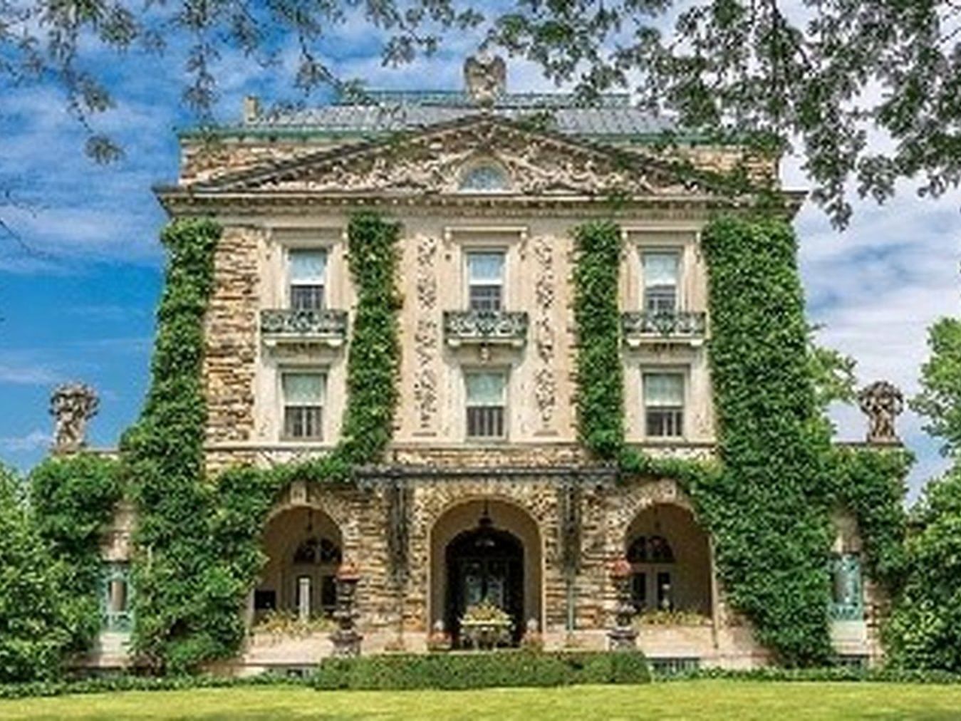Exterior view of Historic Hudson Valley featuring ornate stonework and balconies at The Abbey Inn & Spa