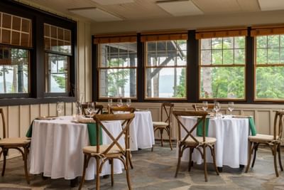 The Overlook Room with tables and chairs in The Lodge in Schroon Lake