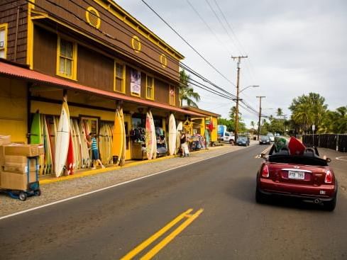 Car parked on the street of Haleiwa Town near Waikiki Resort Hotel by Sono