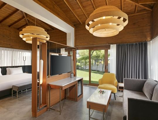 TV lounge area with the bed and sofa in Bali House Garden at Titanic Deluxe Golf Belek