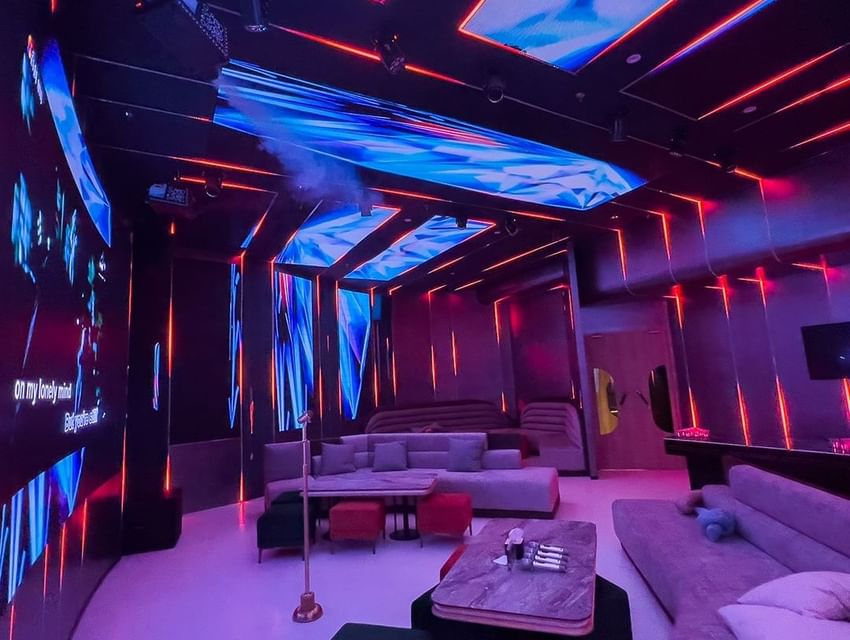 Room interior with illuminating lights & lounge area at Federal Hotels International