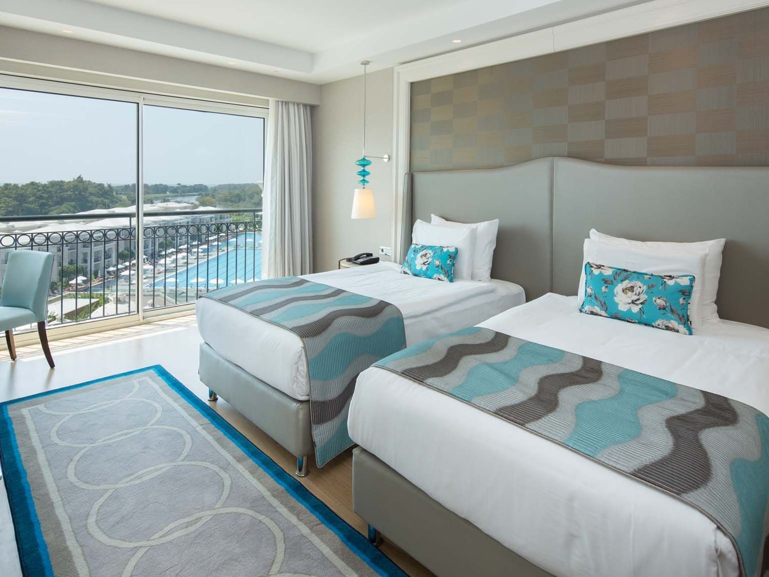 Two beds with cushioned headboard in Corner Suite at Titanic Deluxe Golf Belek