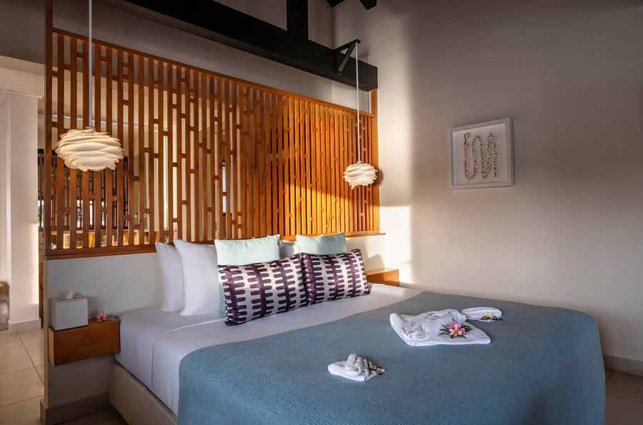 A luxurious bedroom with elegant decor and modern amenities at Warwick Le Lagon - Vanuatu.