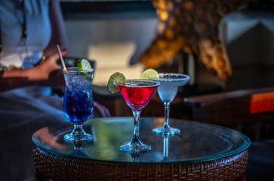 Colorful tropical cocktails served on a woven table in Lobby Bar at warwick le lagon-vanuatu
