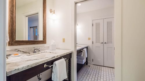 Bathroom vanity area in Premium Resort suite at Watersound Inn
