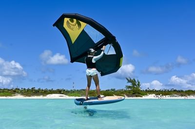 A lady kiteboarding near H2O Life Style Resort
