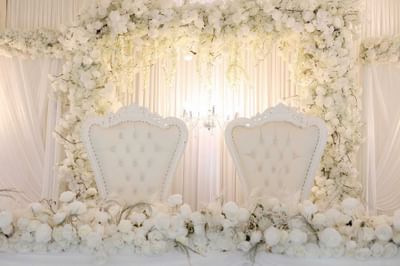 Chairs placed on a stage for the newly weds at Orsett Hall Hotel