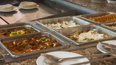 Dishes on buffet table in La Pergola at Araiza Hotel Palmira