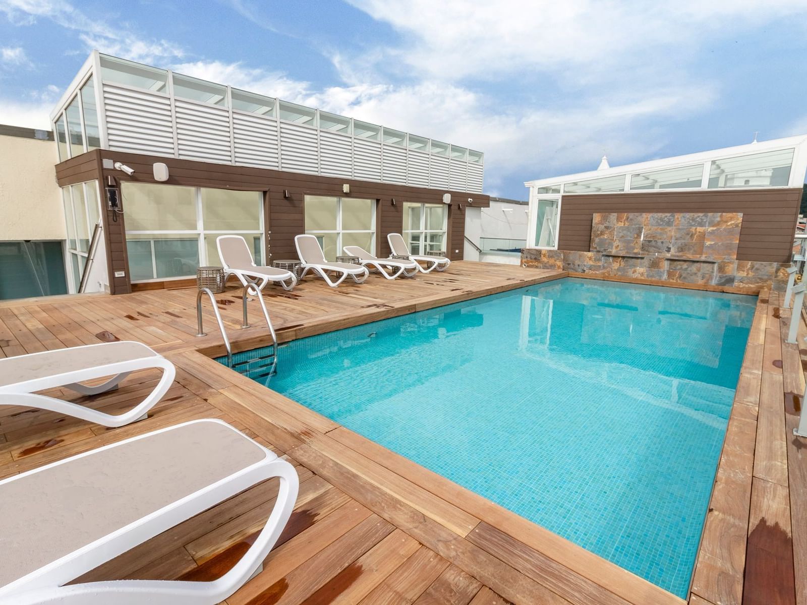 Pool area with lounge chairs at Central Hotel Panama