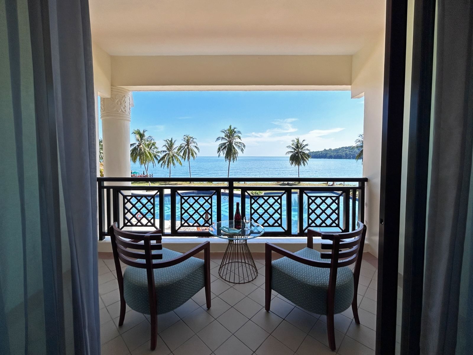 Lounge area by balcony with sea view at Damai Lagoon Resort