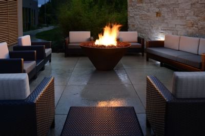 patio area with wicker furniture and fireplace