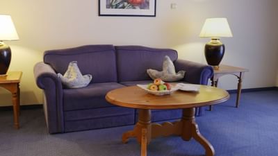 Sofa & a coffee table in Comfort Suite at Liebes Rot Flueh