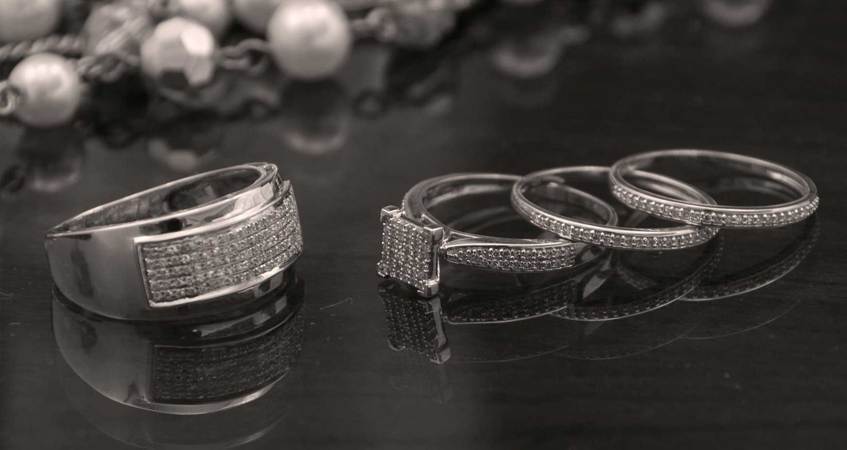 Black & white close-up image of wedding ring bands at Courtleigh Hotel & Suites