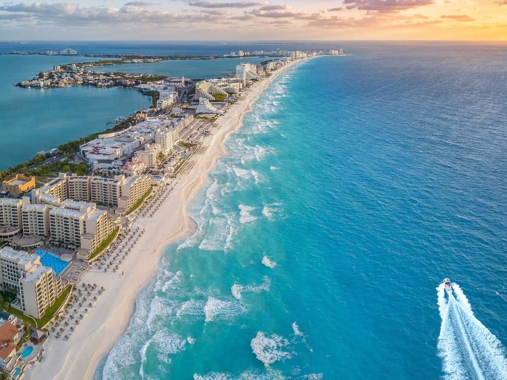 A view a beach line with buildings in Cancún city