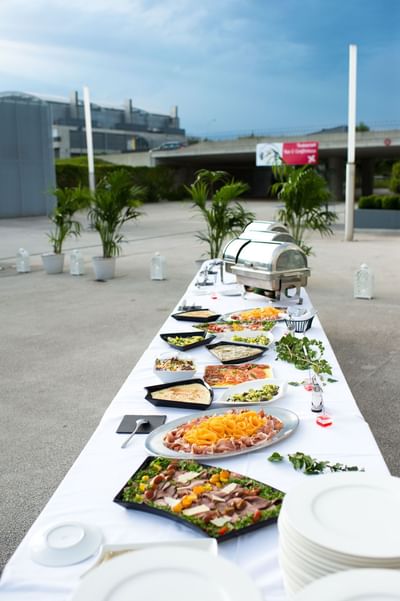 Buffet table arranged for an event outdoors for team building Lausanne at Starling Hotel Lausanne