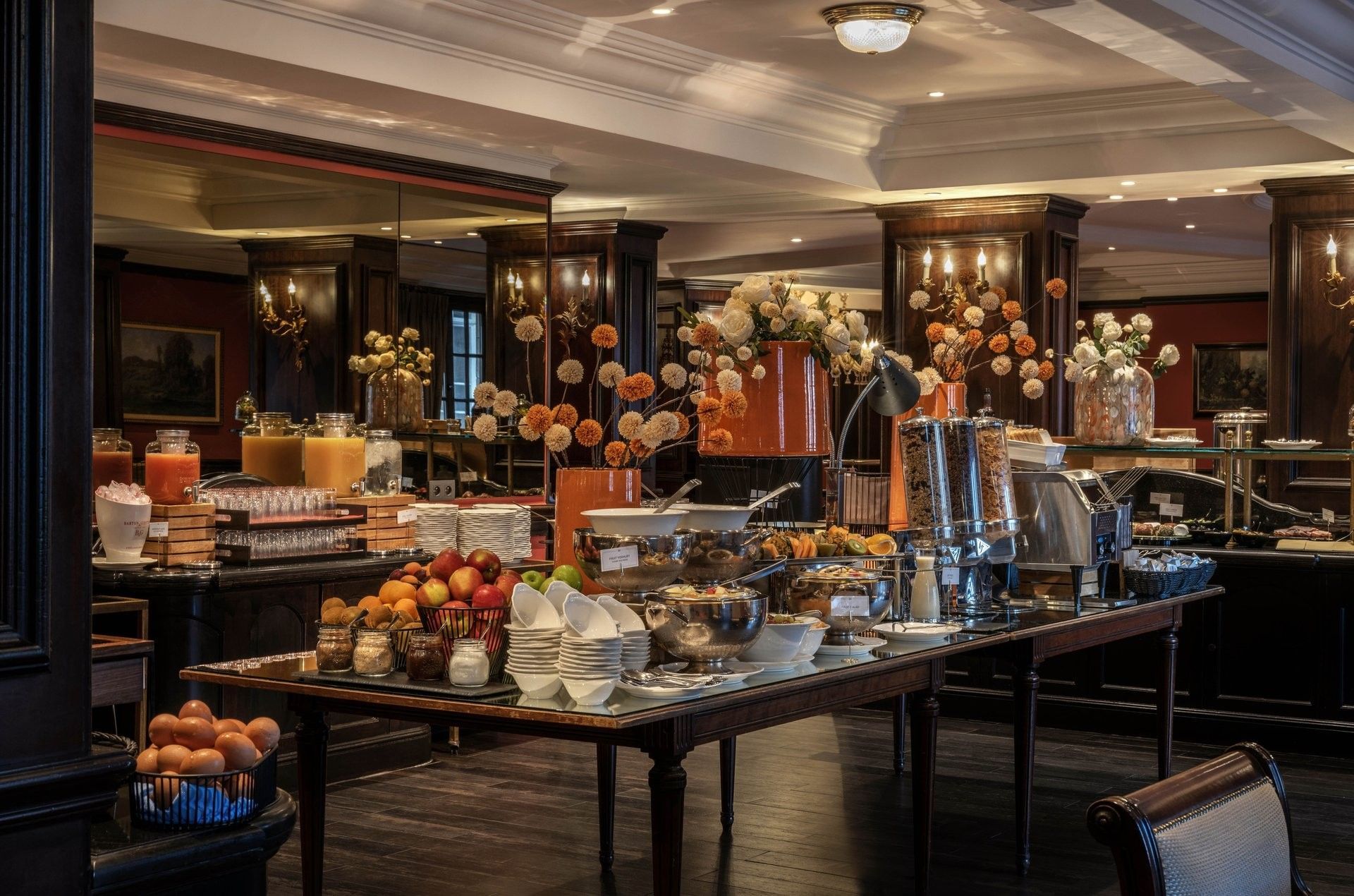 Buffet breakfast table with fresh fruits, pastries, and coffee at Warwick Grand-Place Brussels