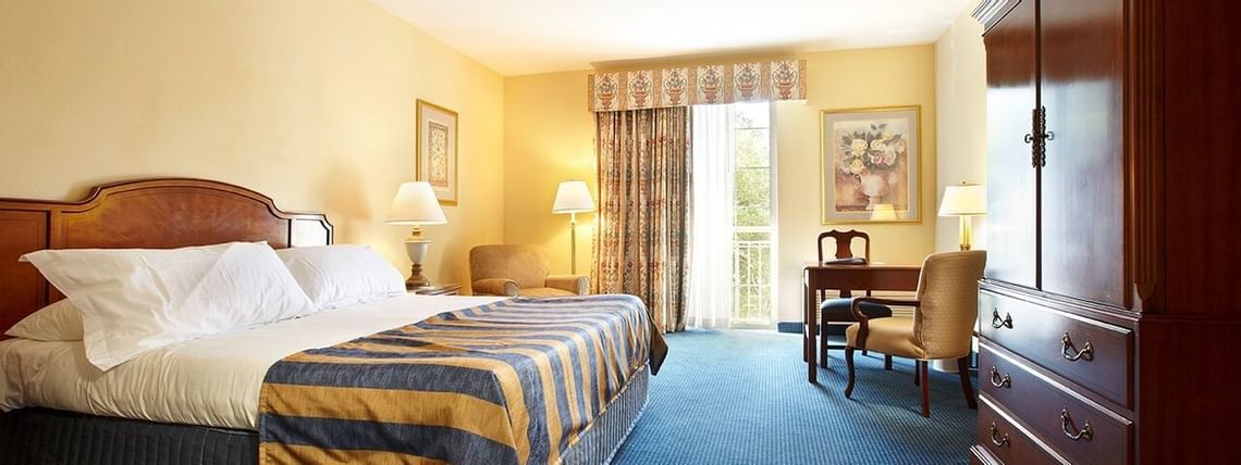King bed & desk in Standard Guest Rooms at Trianon Bonita Bay