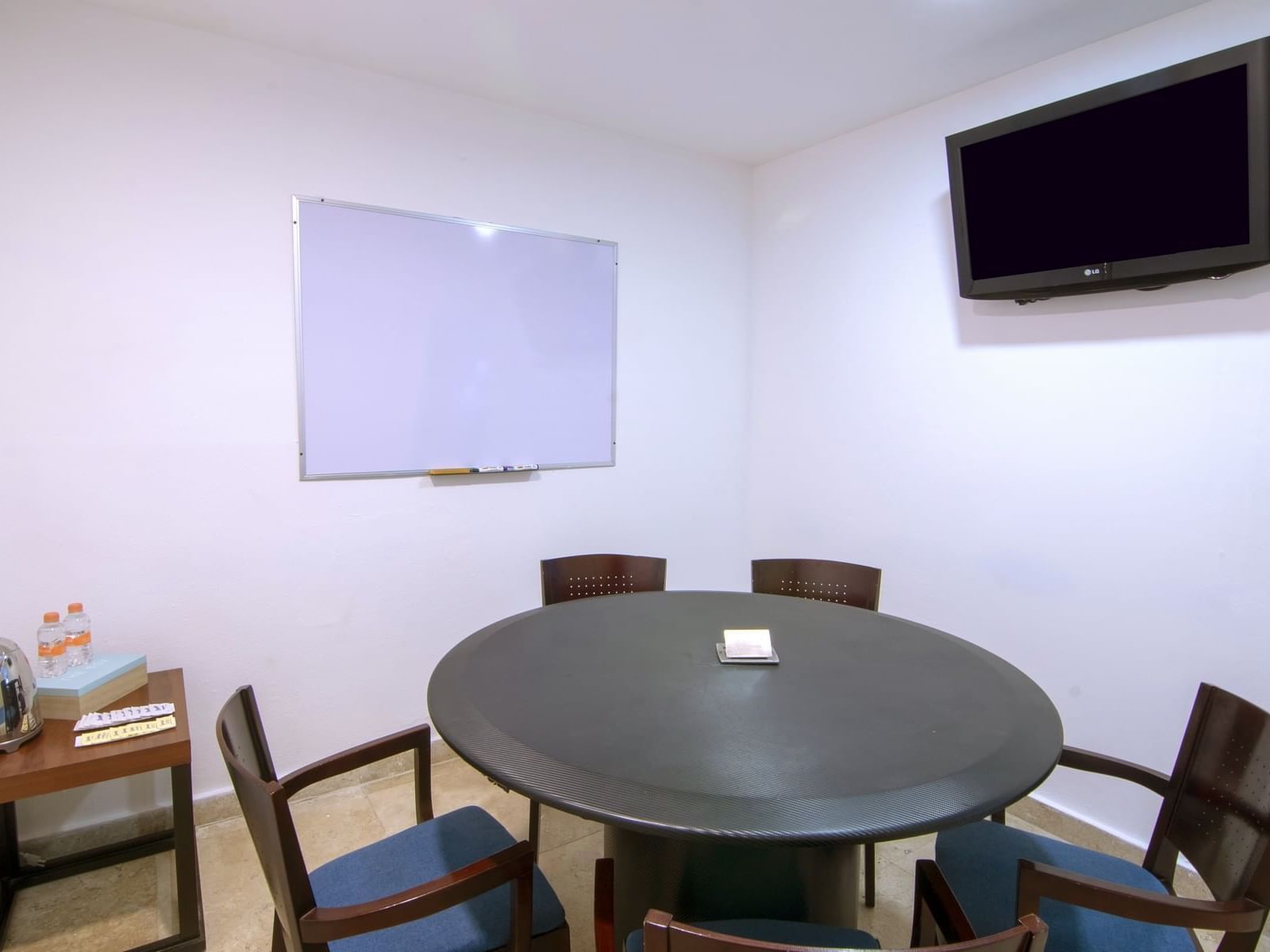 Boardroom table & TV in a Meeting Room at One Hotels