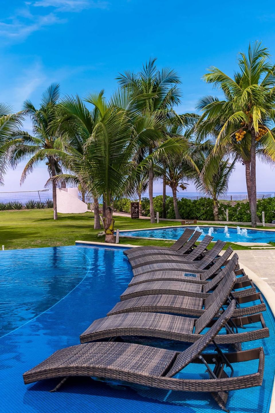 View of sunbeds by the outdoor pool at La Mar Monterrico