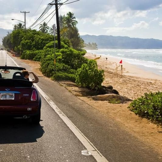 Landscape view of the busy street on a sunny day near Waikiki Resort Hotel by Sono